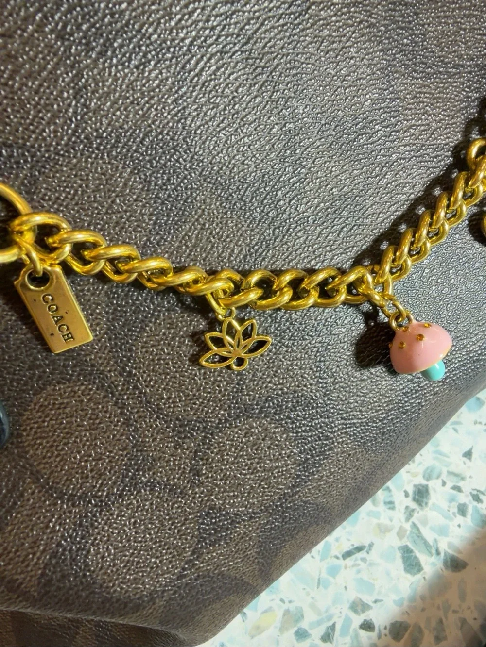 Coach Gold-Tone Charm Bracelet with Pink & Blue Mushroom and Red Book Charms